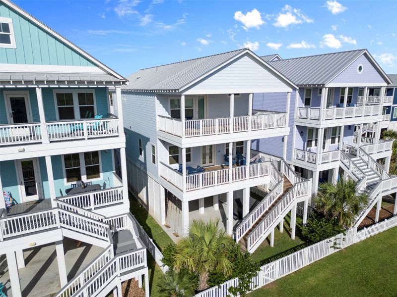 A bold exterior with designer flair. Surrounded by a neighborhood of colorful coastal homes, this personality-packed façade turns heads with its fresh aesthetic—capturing the joyful energy of seaside living with a sophisticated edge. A bold exterior with designer flair. Surrounded by a neighborhood of colorful coastal homes, this personality-packed façade turns heads with its fresh aesthetic—capturing the joyful energy of seaside living with a sophisticated edge.