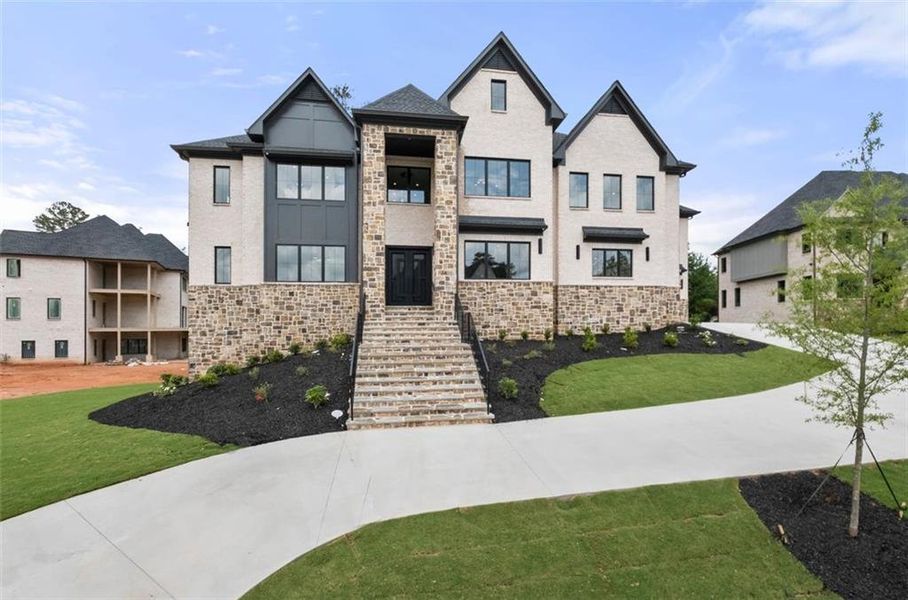 Front exterior of a new home in Timber Rock Manor, Cumming, GA, highlighting curb appeal (Image 29).
