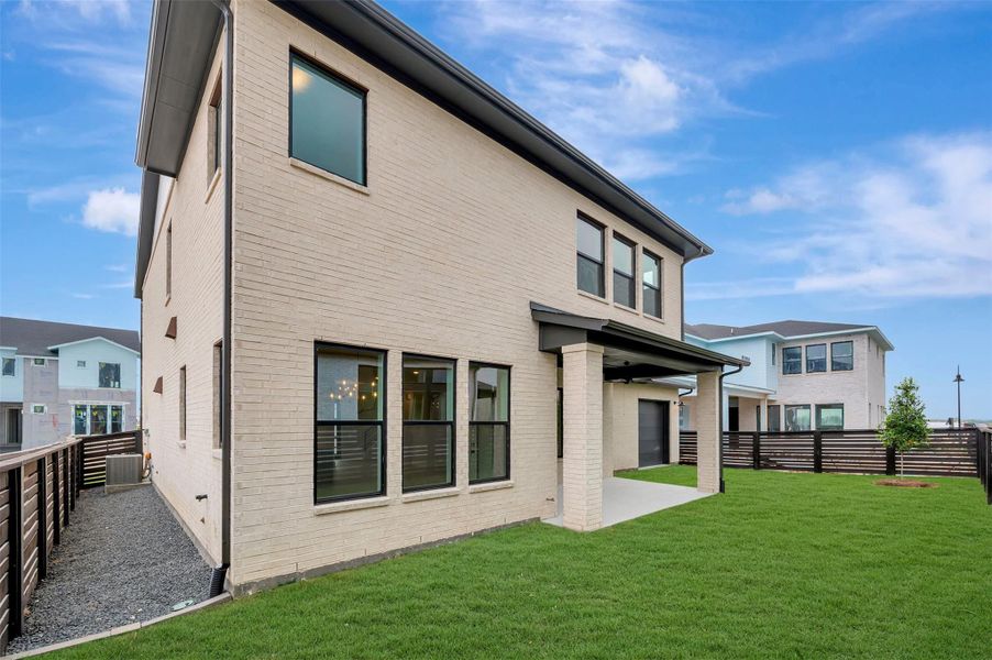 Exterior details and patio area of a home in Easthaven at Bridgeland Central - Horizon Collection, Cypress (Image 4). Exterior details and patio area of a home in Easthaven at Bridgeland Central - Horizon Collection, Cypress (Image 4).