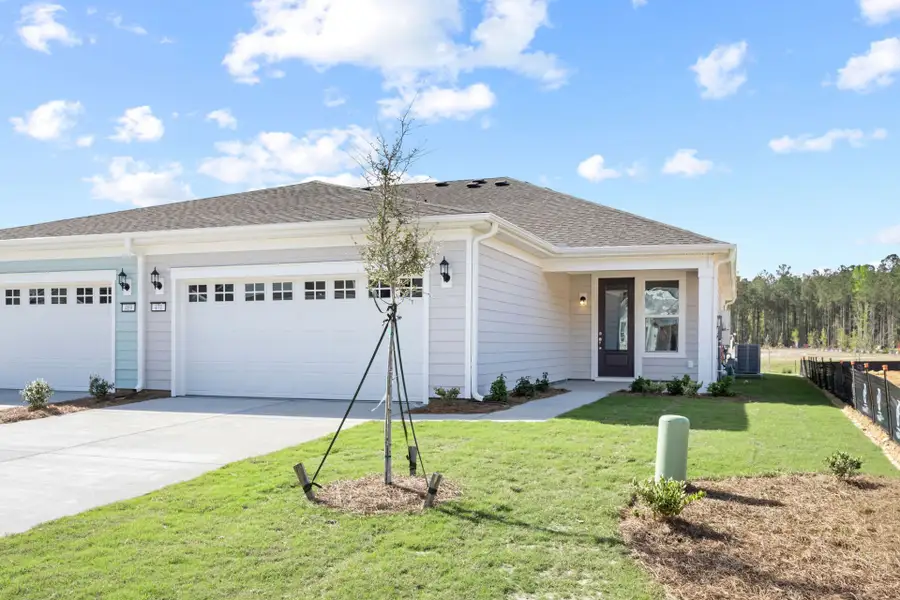 Front exterior of a new home in Sun City Hilton Head, Bluffton, SC, highlighting curb appeal (Image 1). Front exterior of a new home in Sun City Hilton Head, Bluffton, SC, highlighting curb appeal (Image 1).