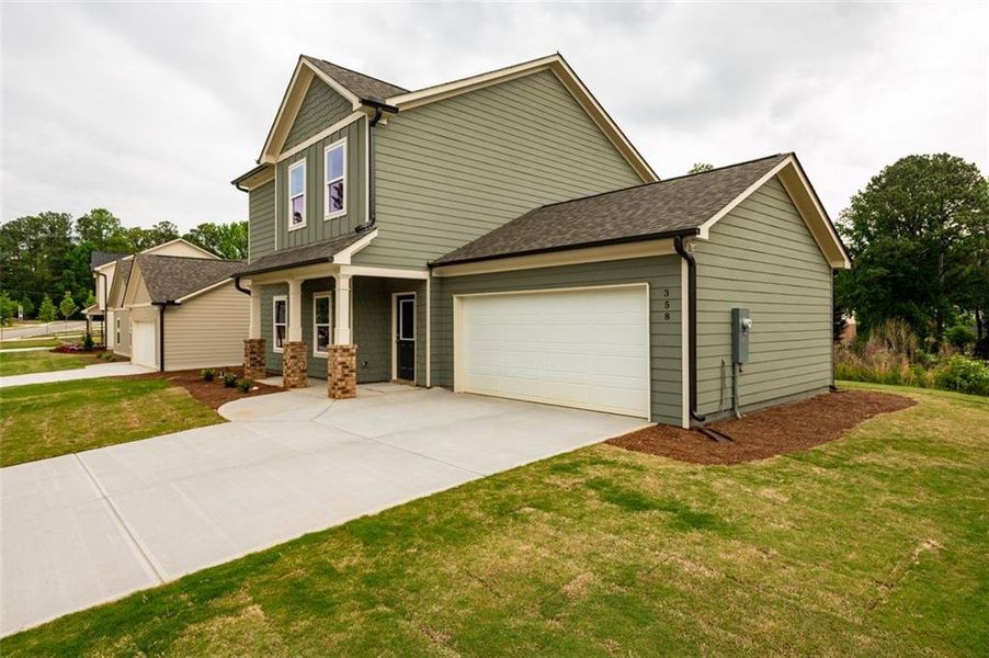 Front exterior of a new home in , Lawrenceville, GA, highlighting curb appeal (Image 14).