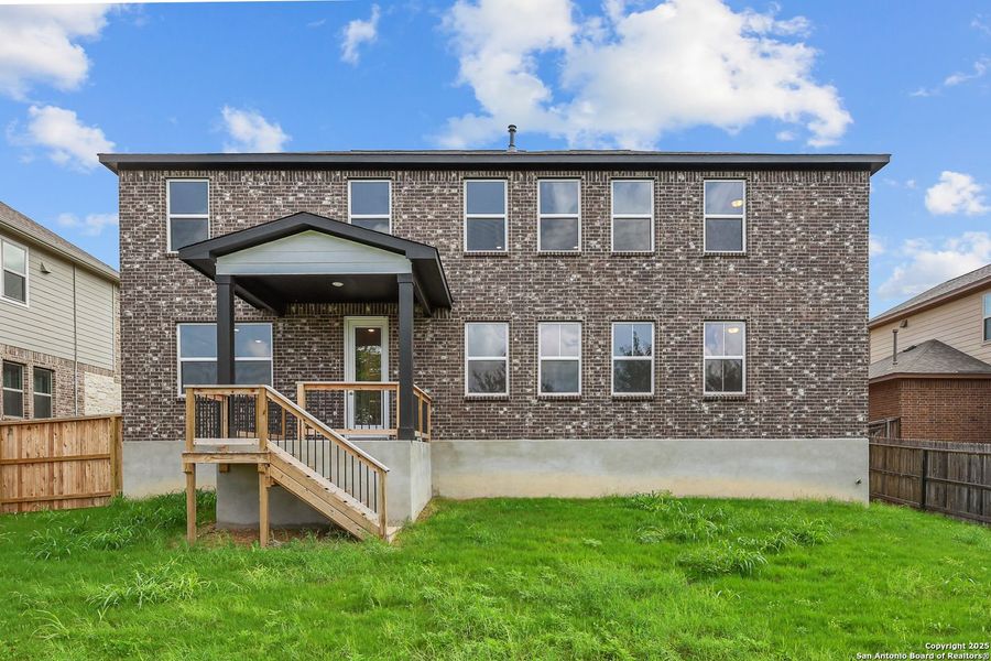 Front exterior of a new home in Ladera, San Antonio, TX, highlighting curb appeal (Image 47).