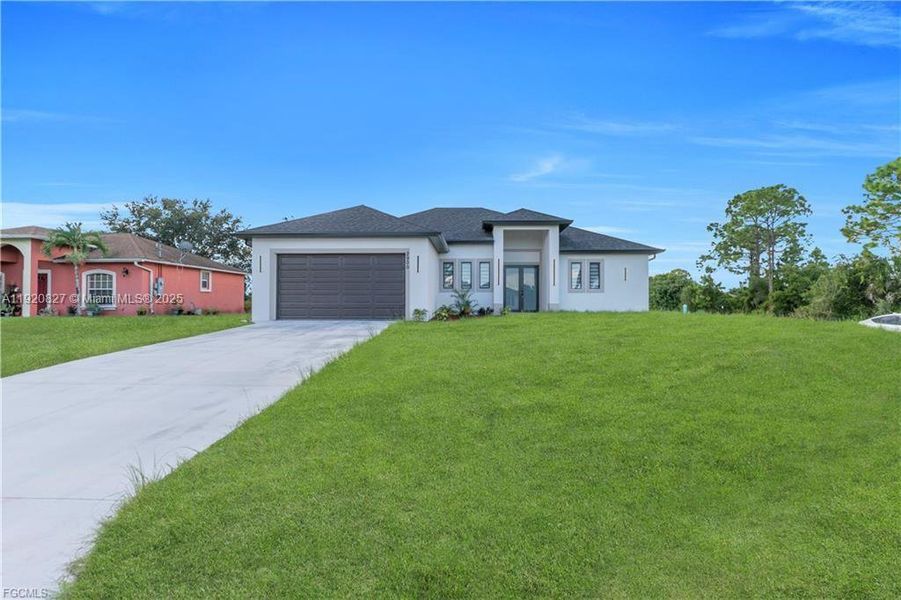 Front exterior of a new home in , Lehigh Acres, FL, highlighting curb appeal (Image 1). Front exterior of a new home in , Lehigh Acres, FL, highlighting curb appeal (Image 1).