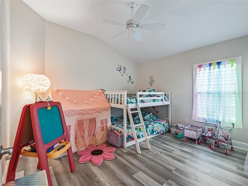 Third bedroom with vaulted ceiling and plantation shutters