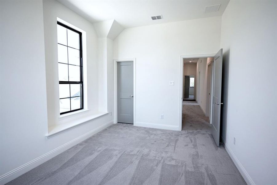 Upstairs Bedroom with view to the hall, Bathroom and Game Room