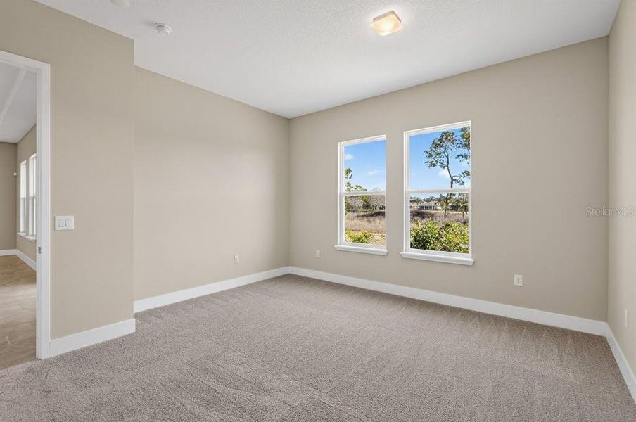 Spacious, unfurnished interior of a new home in Gray Hawk at Hole Two, Daytona Beach (Image 54).