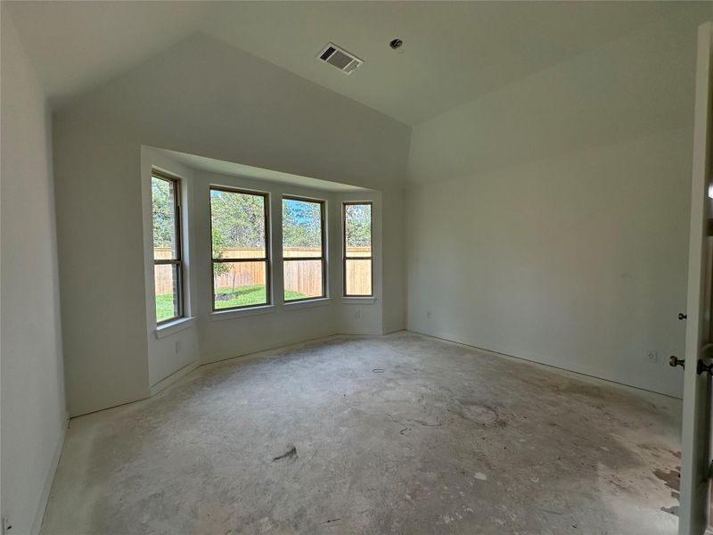 Bay window, vaulted ceilings, and a tree-lined view, all together in your primary bedroom. Bay window, vaulted ceilings, and a tree-lined view, all together in your primary bedroom.