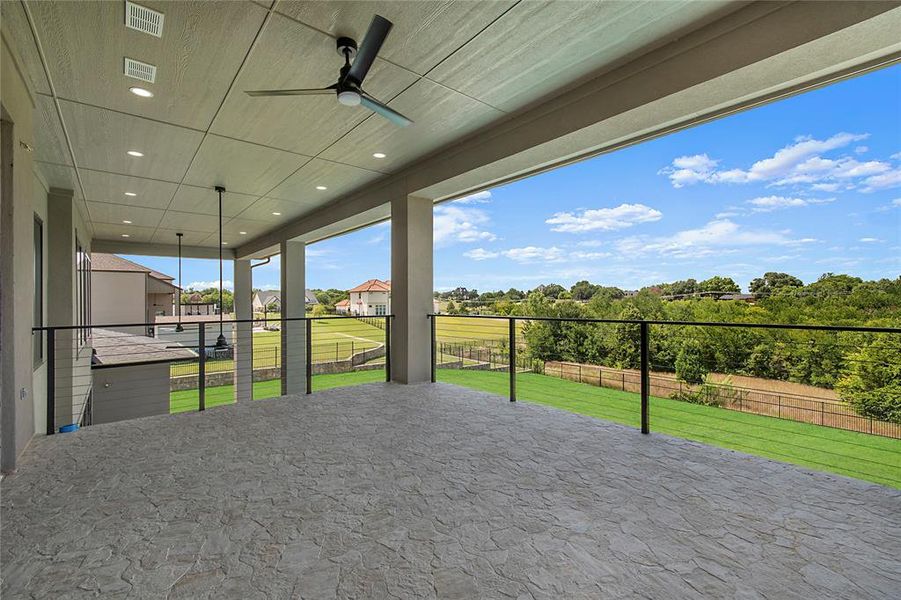 View of patio / terrace featuring ceiling fan and a residential view