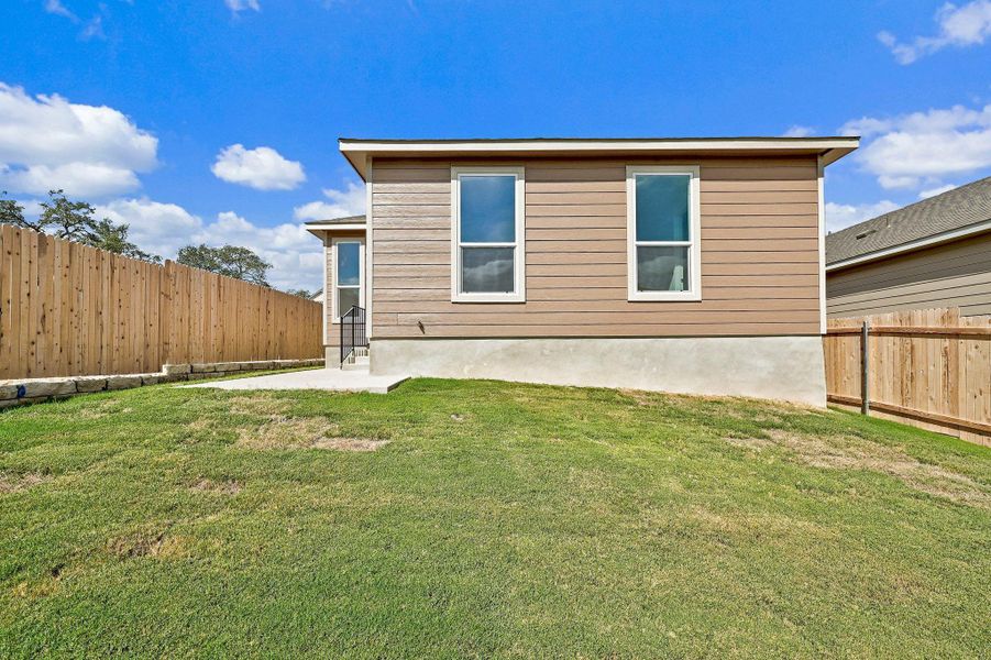 Exterior details and patio area of a home in Creekside at Estancia, Austin (Image 15).