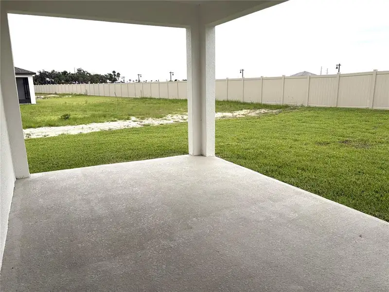 Exterior details and patio area of a home in Oakfield Trails, Parrish (Image 4).