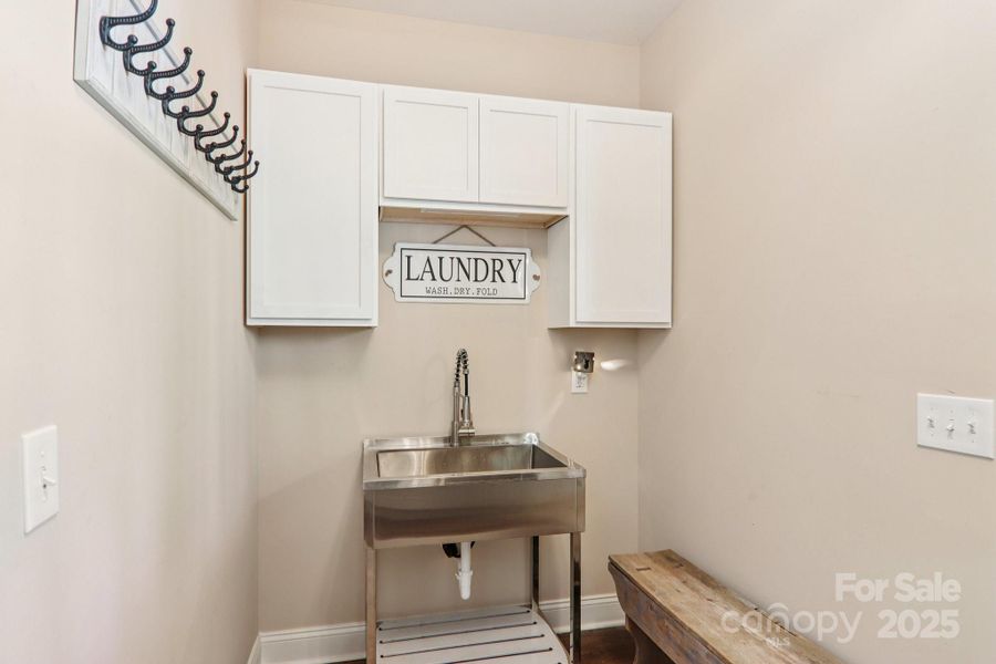 Laundry room/mud room on main level.