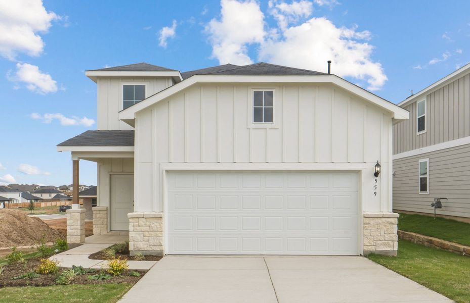 Front exterior of a new home in Sunfield, Buda, TX, highlighting curb appeal (Image 2). Front exterior of a new home in Sunfield, Buda, TX, highlighting curb appeal (Image 2).