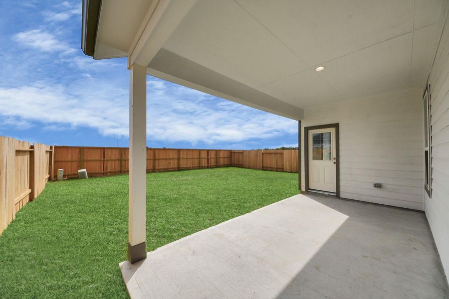 Come and see this spacious backyard with its beautiful covered patio. There is plenty of room for the kids to play and adults to relax. Perfect for your outdoor living space, patio furniture, bbq pit, and so much more. The possibilities are endless! Sample photo of completed home with similar floor plan. Actual colors and selections may vary. Come and see this spacious backyard with its beautiful covered patio. There is plenty of room for the kids to play and adults to relax. Perfect for your outdoor living space, patio furniture, bbq pit, and so much more. The possibilities are endless! Sample photo of completed home with similar floor plan. Actual colors and selections may vary.