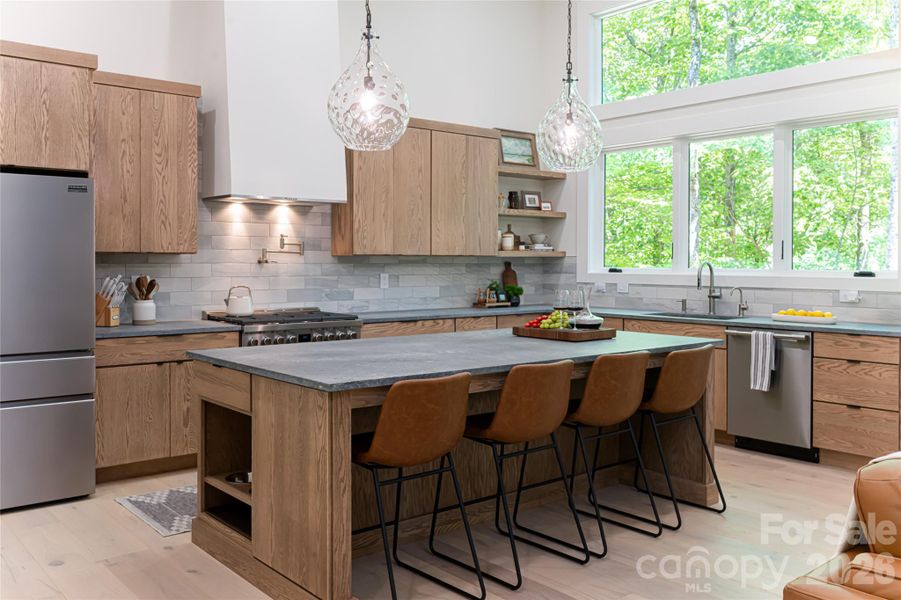 Soapstone countertops, oversized island, oak cabinets, loads of natural light, gas range... a chef's delight