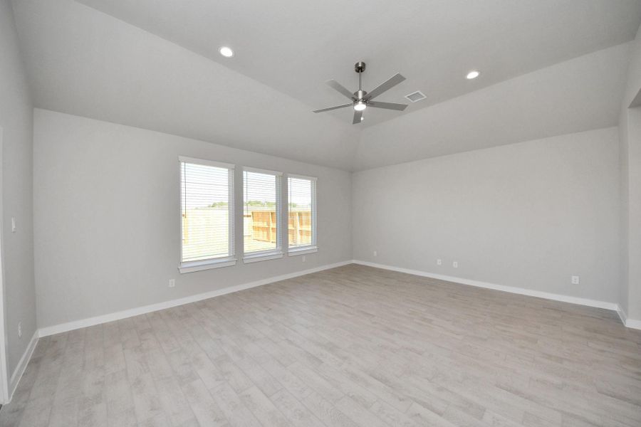 Welcome family and guests to your charming living room! With its high ceilings, recessed lighting, ceiling fan, custom paint, beautiful flooring, and large windows that let in abundant natural light, this room is perfect for gatherings. Sample photo of completed home with similar floor plan. Actual colors and selections may vary. Welcome family and guests to your charming living room! With its high ceilings, recessed lighting, ceiling fan, custom paint, beautiful flooring, and large windows that let in abundant natural light, this room is perfect for gatherings. Sample photo of completed home with similar floor plan. Actual colors and selections may vary.