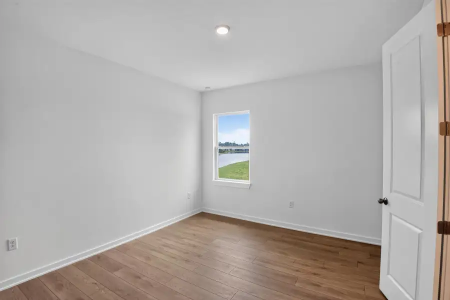 Spacious, unfurnished interior of a new home in Ardisia Park, New Smyrna Beach (Image 23).