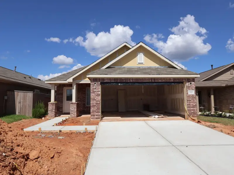 Front exterior of a new home in Moran Ranch, Willis, TX, highlighting curb appeal (Image 1). Front exterior of a new home in Moran Ranch, Willis, TX, highlighting curb appeal (Image 1).