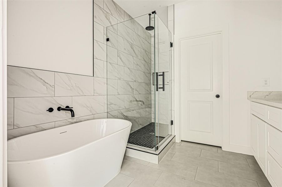 Full bathroom with modern fixtures and clean finishes. Full bathroom with modern fixtures and clean finishes.