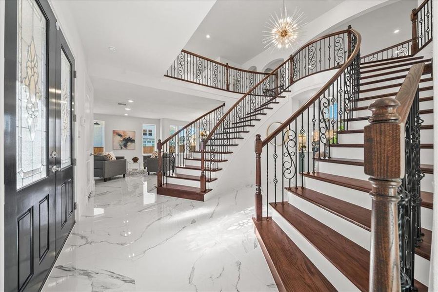Foyer with a chandelier, light marble finish flooring, recessed lighting, Foyer with a chandelier, light marble finish flooring, recessed lighting,