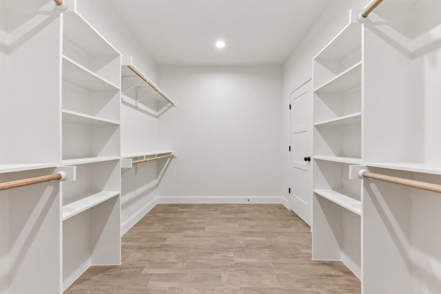 Primary closet with loads of storage Primary closet with loads of storage