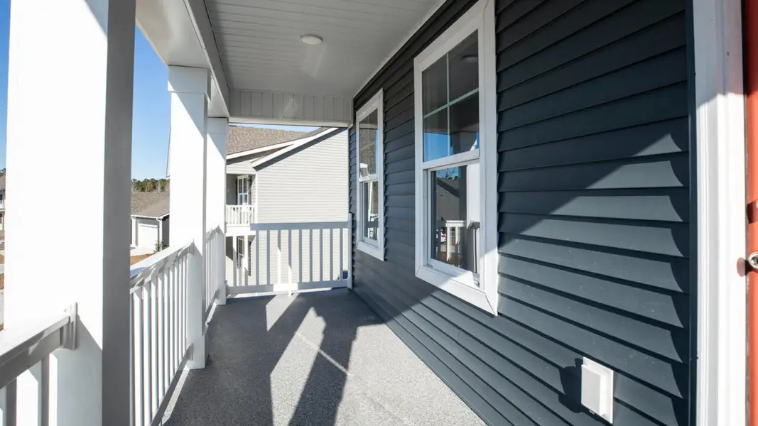 Exterior details and patio area of a home in The Haven at Indigo Preserve, Leland (Image 3).