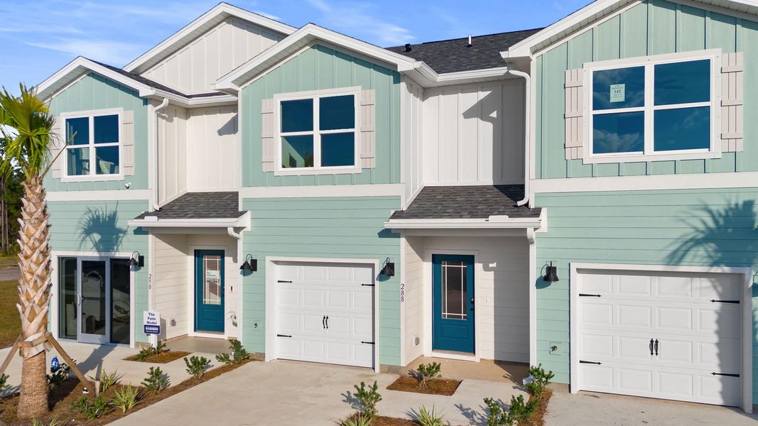 Front exterior of a new home in Colonial East Townhomes, Panama City Beach, FL, highlighting curb appeal (Image 1).
