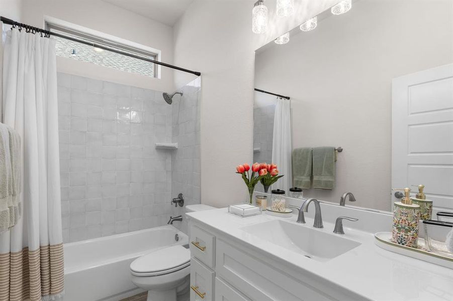 Bathroom with shower / bath combo with shower curtain and vanity Bathroom with shower / bath combo with shower curtain and vanity