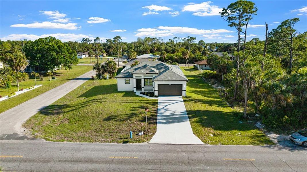 Front exterior of a new home in , Port Charlotte, FL, highlighting curb appeal (Image 21). Front exterior of a new home in , Port Charlotte, FL, highlighting curb appeal (Image 21).