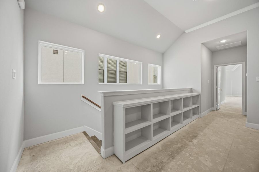 Sunlight streams through clerestory windows, casting the perfect glow on this stylish hallway landing. Bonus: built-in shelving that begs for your favorite reads and travel finds. Sunlight streams through clerestory windows, casting the perfect glow on this stylish hallway landing. Bonus: built-in shelving that begs for your favorite reads and travel finds.