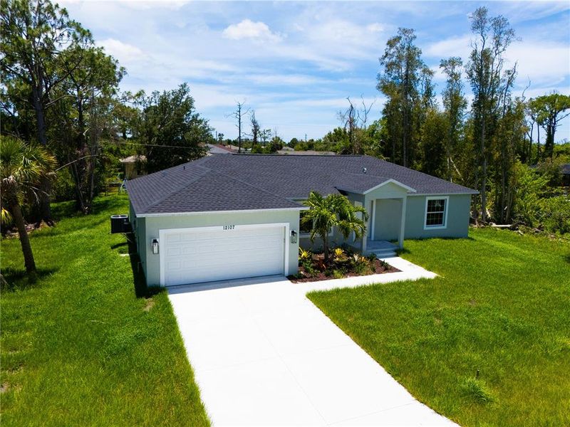 Front exterior of a new home in , Port Charlotte, FL, highlighting curb appeal (Image 2). Front exterior of a new home in , Port Charlotte, FL, highlighting curb appeal (Image 2).
