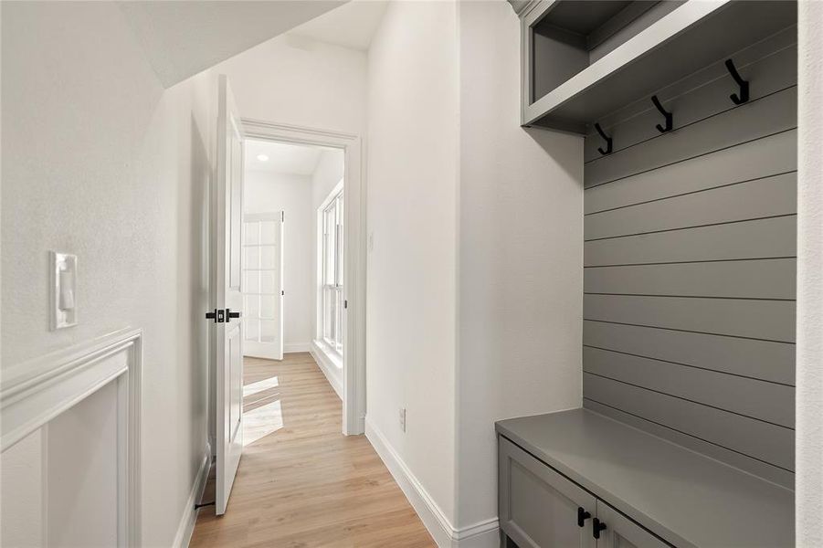 Mudroom featuring light wood-type flooring