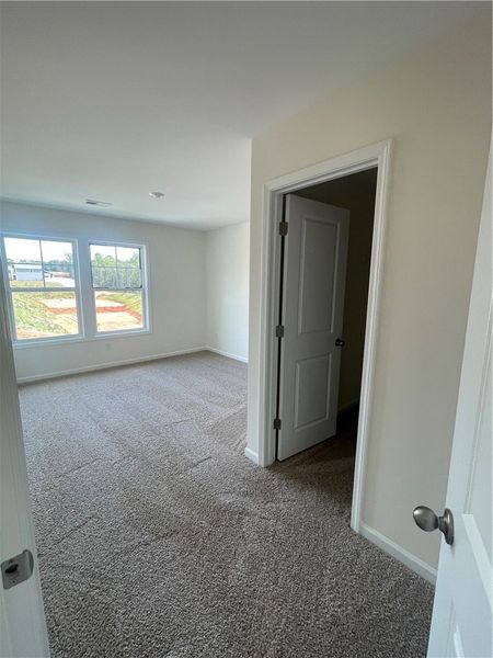 Spacious, unfurnished interior of a new home in Springwood Grove, Central (Image 24).