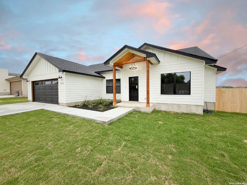 Exterior details and patio area of a home in , Devine (Image 27).
