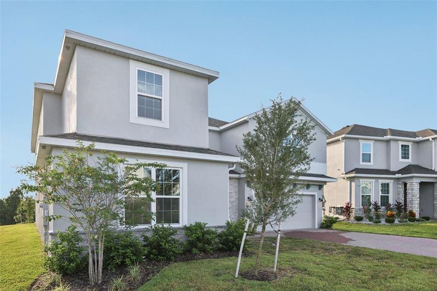 Front exterior of a new home in , Groveland, FL, highlighting curb appeal (Image 21). Front exterior of a new home in , Groveland, FL, highlighting curb appeal (Image 21).
