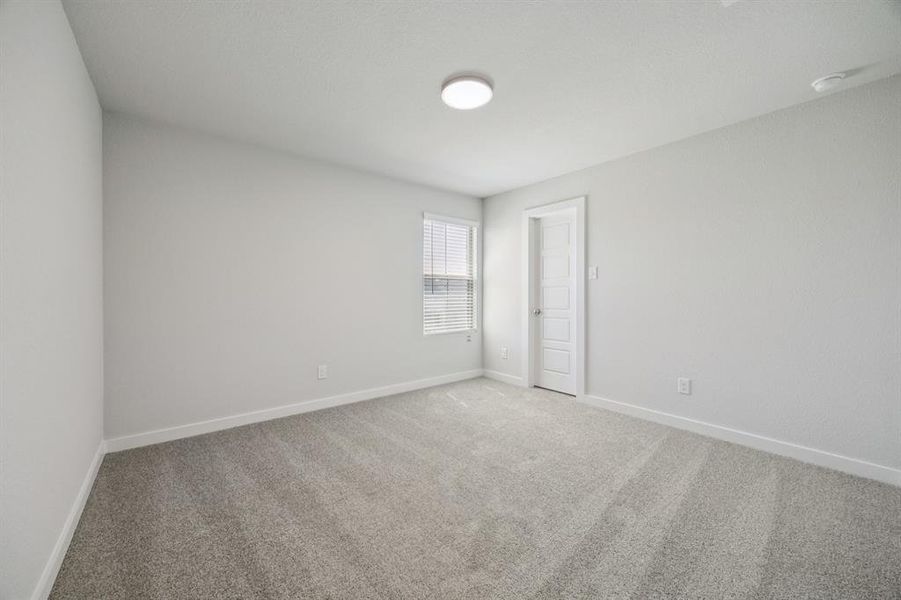 Bedroom in the Haylee home plan by Trophy Signature Homes - REPRESENTATIVE PHOTO