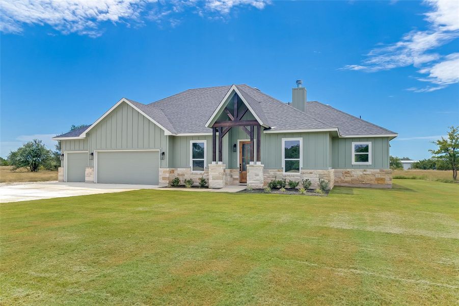 Front exterior of a new home in , Bertram, TX, highlighting curb appeal (Image 24). Front exterior of a new home in , Bertram, TX, highlighting curb appeal (Image 24).