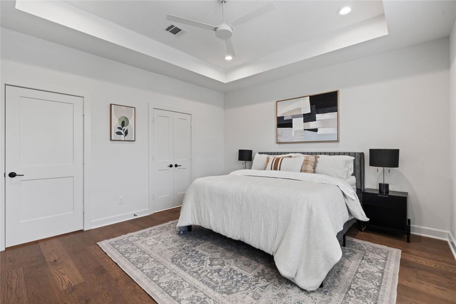 The primary bedroom highlights plenty of space to design the room the way you want- comfortably fitting a bed, nightstands, and even extra seating.