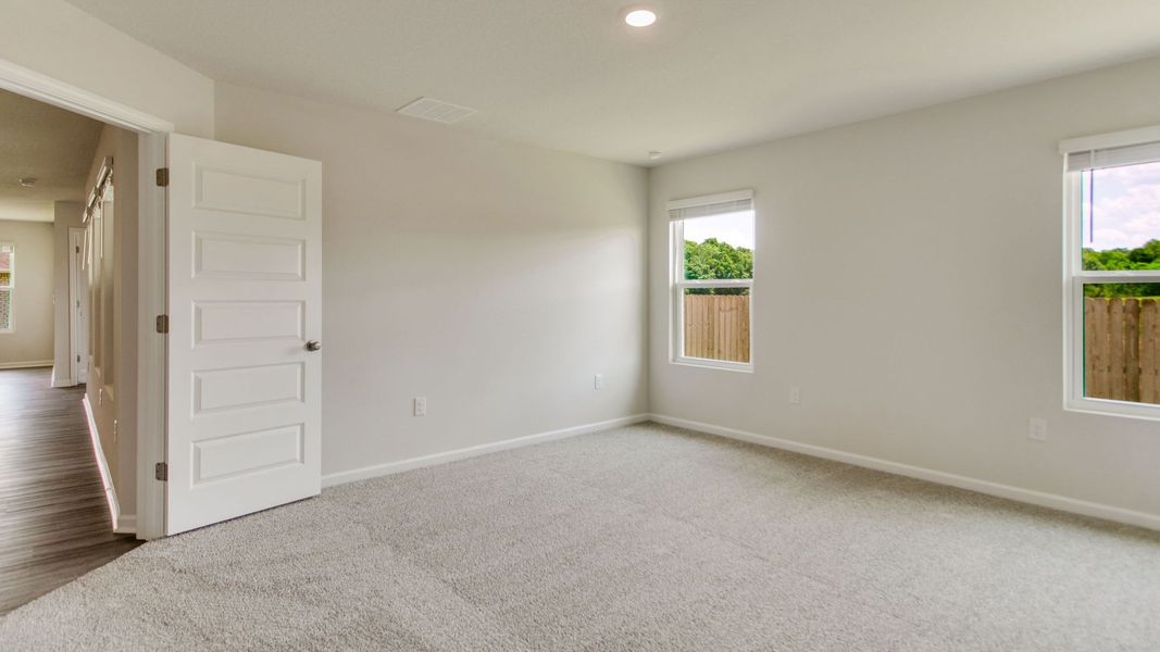 Spacious, unfurnished interior of a new home in The Enclave at Bar W Ranch, Baker (Image 19).
