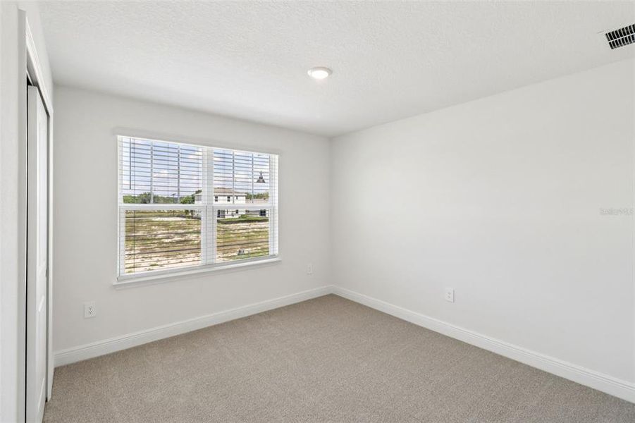 Spacious, unfurnished interior of a new home in The Reserve at Hammock Oaks - Classic Series, Lady Lake (Image 25).