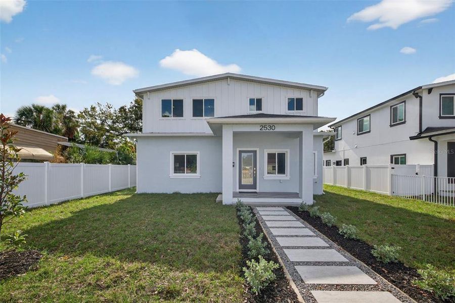 Front exterior of a new home in , St. Petersburg, FL, highlighting curb appeal (Image 1). Front exterior of a new home in , St. Petersburg, FL, highlighting curb appeal (Image 1).