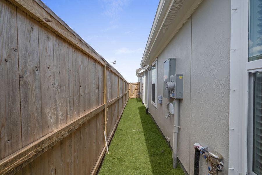 Exterior details and patio area of a home in Meridiana, Manvel (Image 3).