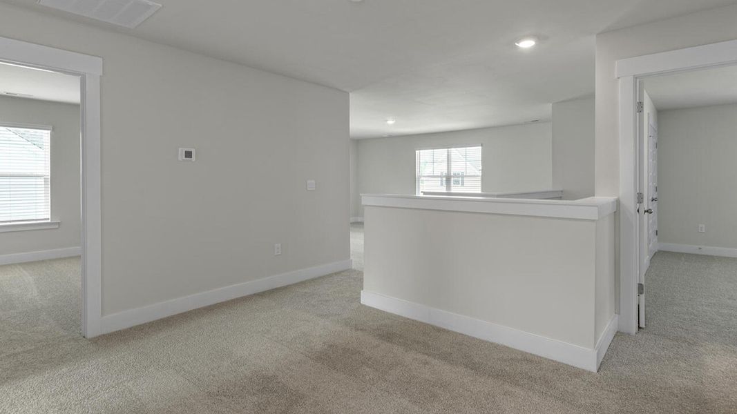 Spacious, unfurnished interior of a new home in Surfside Landing, Hubert (Image 31).