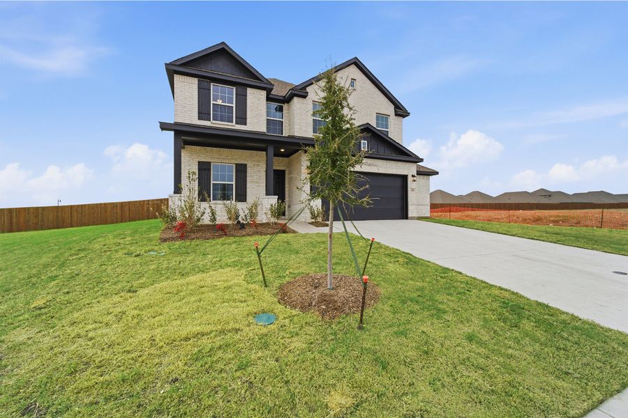 Front exterior of a new home in Saddlebrook Estates, Waxahachie, TX, highlighting curb appeal (Image 2).