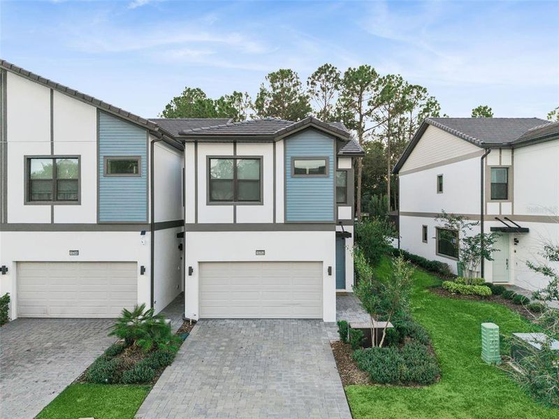 Front exterior of a new home in Paradiso Grande, Orlando, FL, highlighting curb appeal (Image 2).