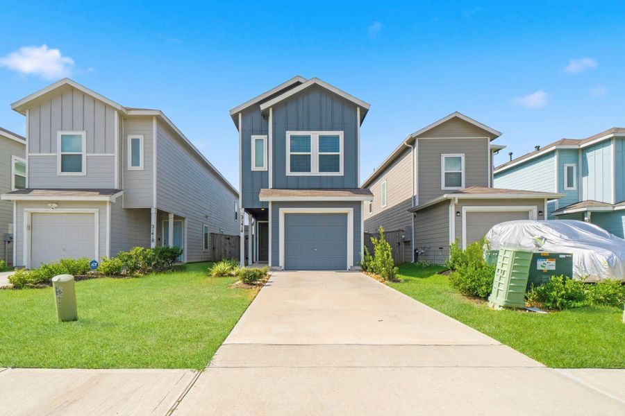 Front exterior of a new home in Tavola, New Caney, TX, highlighting curb appeal (Image 20).