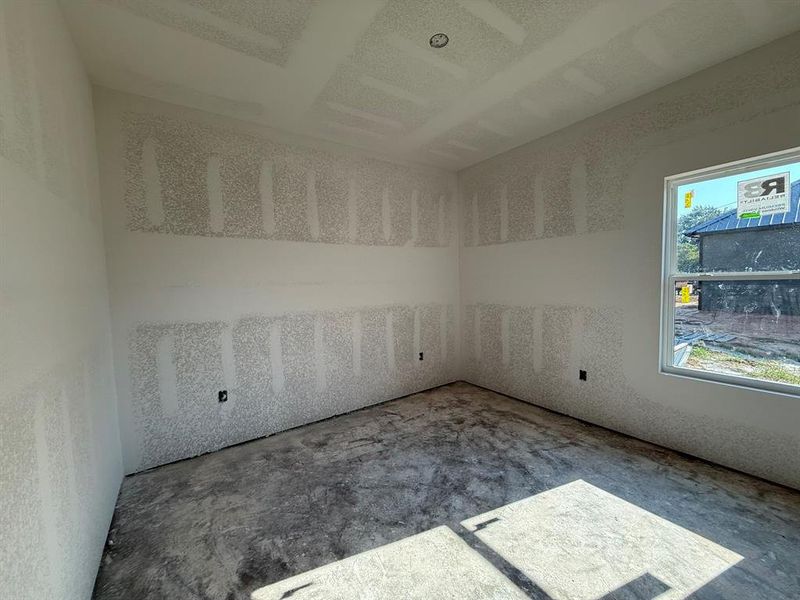 Spare room featuring concrete floors