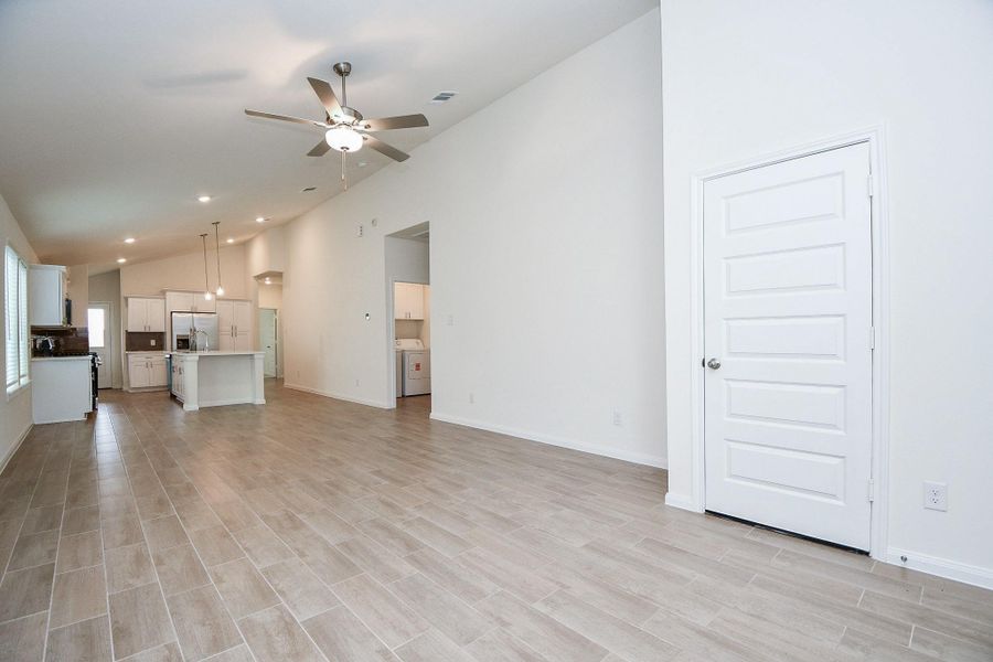 Notice the gorgeous, wood-look flooring and the neutral-toned walls that make a perfect canvas for your decor! This living space is equipped with a beautiful ceiling fan to ensure comfortable temperatures year-round.