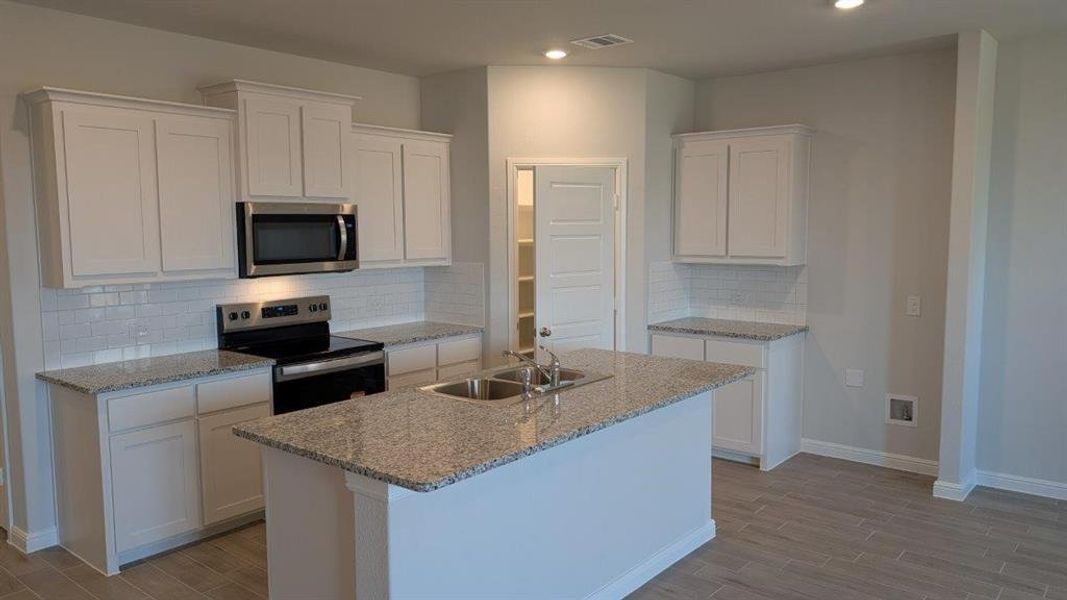 Kitchen - All Home and community information, including pricing, included features, terms, availability and amenities, are subject to change at any time without notice or obligation. All Drawings, pictures, photographs, video, square footages, floor plans, elevations, features, colors and sizes are approximate for illustration purposes only and will vary from the homes as built.