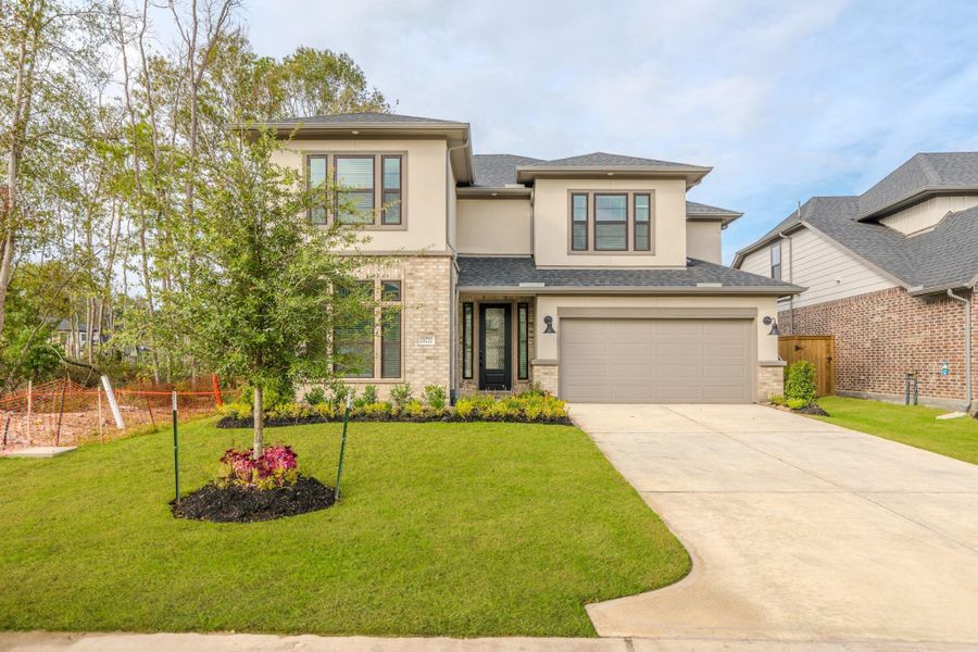 Front exterior of a new home in , Porter, TX, highlighting curb appeal (Image 23).