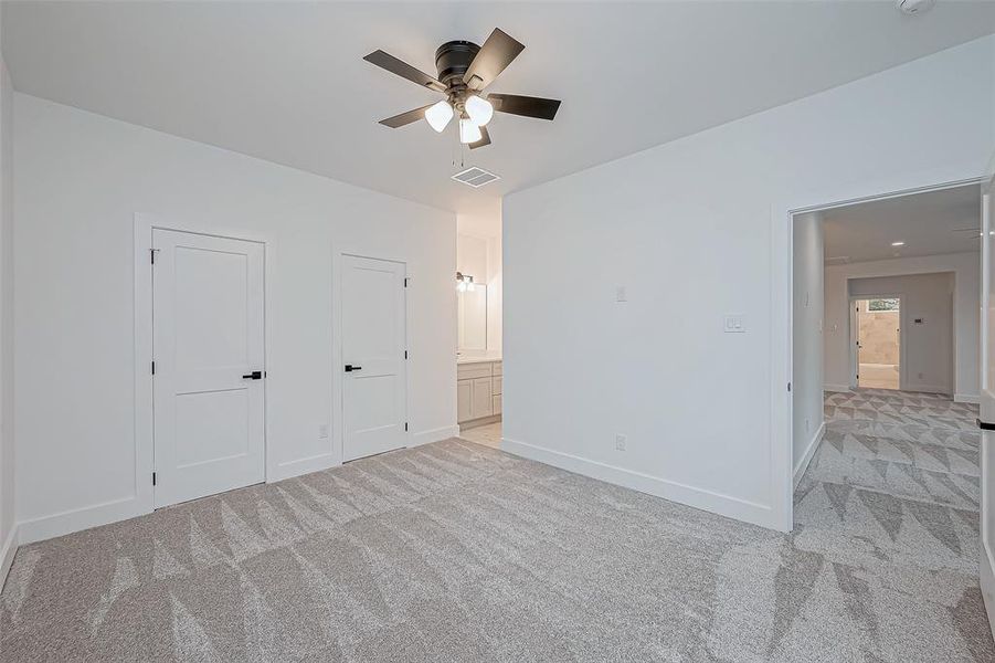 secondary bedroom upstairs with its own private sink area